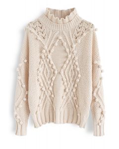 Suéter de punto de ochos con pompones ahuecados en color crema